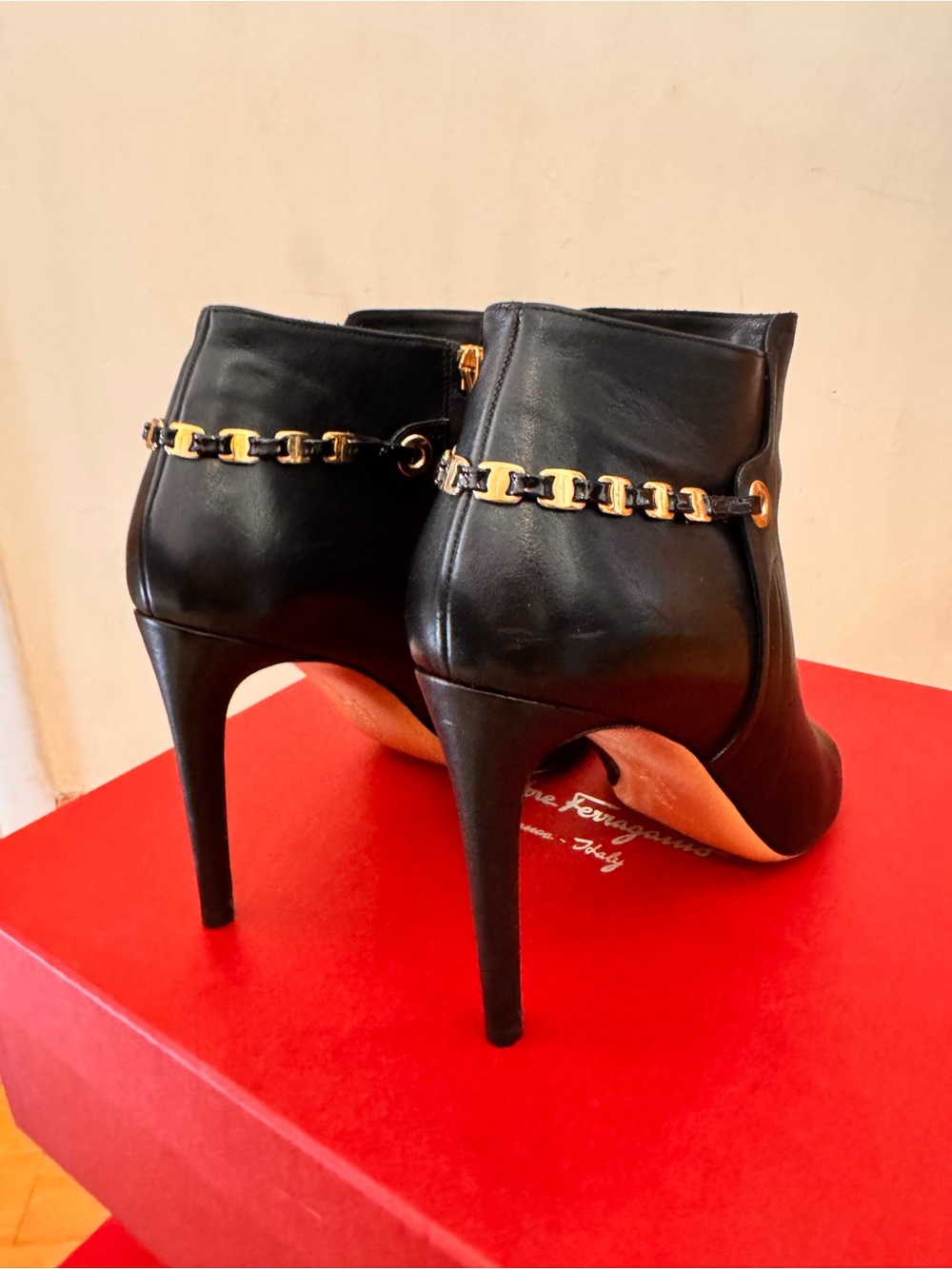 Salvatore Ferragamo Black Leather Ankle Booties with Gold Chain Trim
